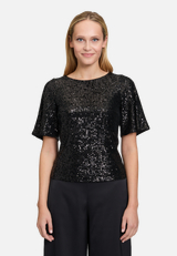 Pailletten-Bluse mit Flügelärmeln / Modellfoto Vorderseite