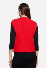 Grobstrickjacke ohne Arm / Modellfoto Rückseite
