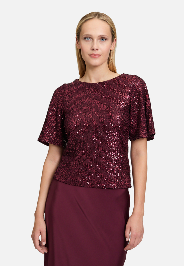 Pailletten-Bluse mit Flügelärmeln / Modellfoto Vorderseite